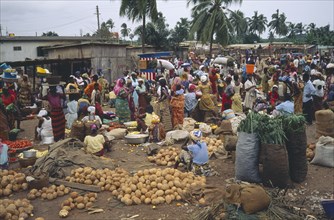 GHANA, Accra, Crowded market scene in village near Accra with mixed produce.