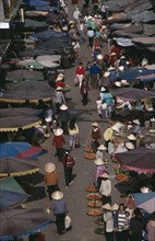VIETNAM, South, Nha Trang, Market scene from above with people in conical hats walking amongst