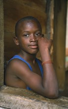 JAMAICA, People, Young boy framed by open window.