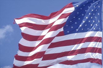 FLAGS, USA, Close up of the stars and stripes flag against a blue sky