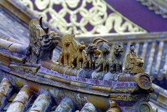 CHINA, Shandong, Qufu, Close up of decorative roof carvings in the ancient grounds where Confucius