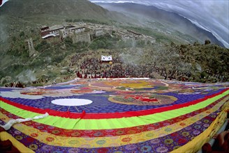 CHINA, Tibet, Drepung Monastery, Wide angled view looking down massive colourful image of buddha to