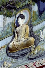 LAOS, Savannakhet, Wat Sainyamungkhun. Buddha carving in the temple wall