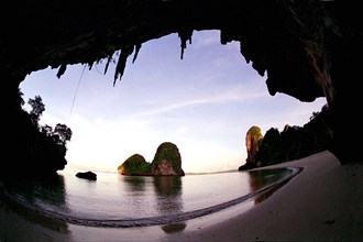 THAILAND, Krabi, Wide angle view of Rai Ley beach framed by overhanging cliff