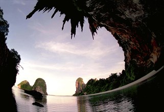 THAILAND, Krabi, Wide angle view of Rai Ley beach framed by overhanging cliffs