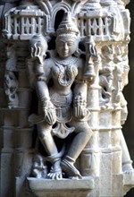 INDIA, Rajasthan, Mt Abu, Decorative carved marble figure at one of the Dilwara Temples