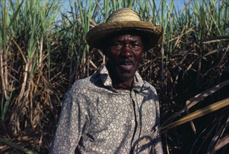 DOMINICAN REPUBLIC, People, Men, Haitian sugar cane cutter.  Head and shoulders portrait.
