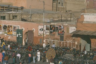 MOROCCO, Marrakech, Bicycles and mopeds lined up outside cinema