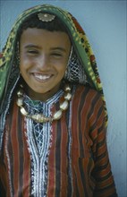 OMAN, People, Children, Portrait of child in traditional dress.