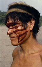 ECUADOR, People, Men, Portrait of Shuar Indian man with painted face. Tribe also known as Jivero