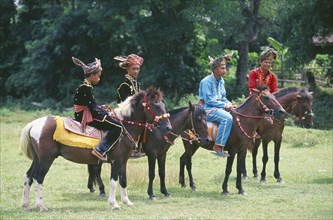 BORNEO, Sabah, Kota Belud, Bajau Dayak horsemen at Tamu or open air market.