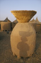 BURKINA FASO, Bisaland, Nida Village, Grain store raised on stones around the base