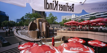 GERMANY, Berlin, Breitscheidplatz. View over red Coca Cola umbrellas toward the World Fountain
