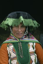 PERU, Cordillera Vilcanota, Head and shoulders portrait of woman from Tinqui.
