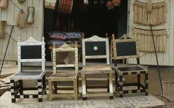 GHANA, Craft, Traditional Ashanti chairs with applied metal decoration.