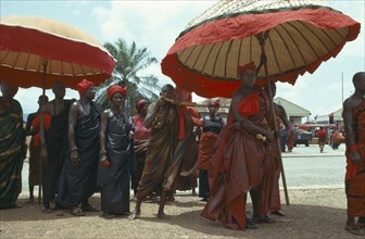 GHANA, Funeral, Ashanti tribe with umbrellas denoting office attending funeral.  Seen as a