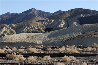 USA, California, Death Valley, View over the desert landscape toward rocky mountainous horizon