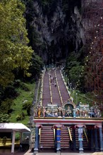 MALAYSIA, Near Kuala Lumpur, Batu Caves, View of steep stairway leading up in to the caves with