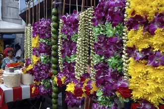 MALAYSIA, Kuala Lumpur, Row of hanging flower garlands ouside an Indian Temple