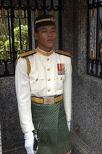 MALAYSIA, Kuala Lumpur, Uniformed guard on duty at the Kings Palace