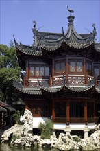 CHINA, Shanghai, Yuyuan Gardens. Traditional style architecture built over water
