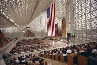 USA, California, Los Angeles, Crystal Cathedral Memorial Service. Congregation in pews under glass