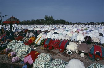 NIGERIA, Katsina, Salah Day marking the end of Ramadan.  Lines of Muslim men at prayer.