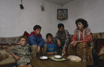 SERBIA, and MONTENEGRO, Kosovo, Poor Albanian family living on bread and cheese