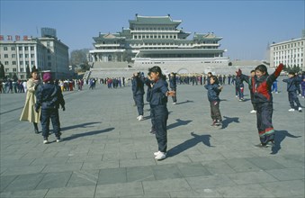 NORTH KOREA, Pyongyang, Group of women having martial arts training in Kim Il sung Square.
