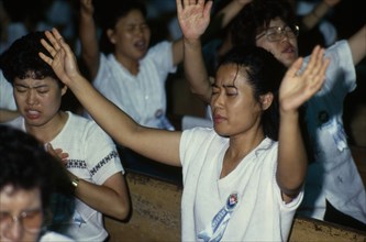 SOUTH KOREA, Seoul, Evangelical Christian crusade.  People in state of religious fervour.