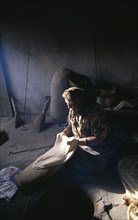 ARMENIA, Noradouz, Woman making traditional bread called lavash.