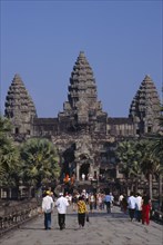 CAMBODIA, Siem Reap, Angkor Wat, The causeway leading to the central complex with  tourist crowds