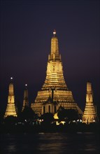 THAILAND, South, Bangkok, Wat Arun The Temple of The Dawn illuminated at sunset