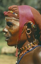 KENYA, Tribal People, Portrait of Samburu warrior wearing ochre body paint.