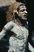 KENYA, Tribal People, Kikuyu tribesman wearing head dress and white body paint.