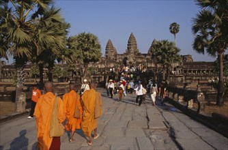 CAMBODIA, Siem Reap Province, Angkor Wat, Buddhist monks and tourists during Chinese New Year on