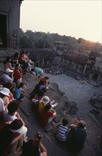 CAMBODIA, Siem Reap Province, Angkor Wat, Tourists with cameras watching the sunset from the