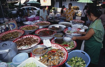 THAILAND, South, Bangkok, Thanon Maharat beside The Imperial Palace with food stall selling cooked