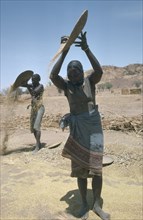SUDAN, South Darfur, Farming, Maslit tribeswomen winnowing millet.
