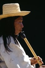 COLOMBIA, Music, Kogi man playing flute.