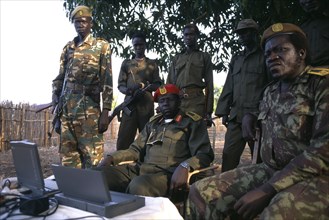 SUDAN, Marida, Commander Geia of the SPLA army sat down surrounded by soldiers with a lap top