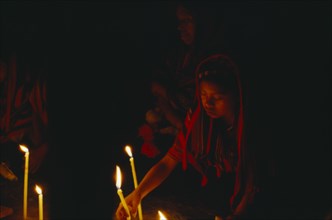 GUATEMALA, "				", Cakchiquel Maya, Woman taking part in candlelit prayers