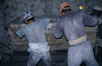 BOLIVIA, Potosi, Cerro Rico, "Rosaria mine.  Mining for tin and silver, miners working underground