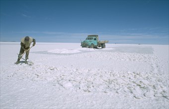 BOLIVIA, Potosi, Altiplano, Salar de Uyuni.  Miner on expanse of salt flats near Colchani.