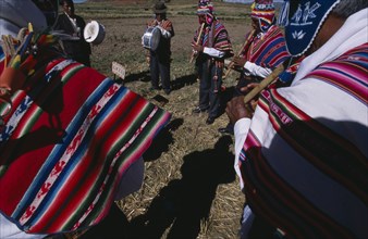 BOLIVIA, La Paz, Lake Titicaca, Kopancara.  Fiesta de la Cruz.  Musicians playing pipes and drums.