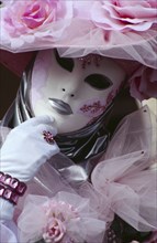 ITALY, Veneto, Venice, Venice Carnevale. Close up portrait of a female figure dressed in a white