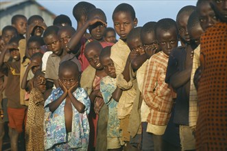TANZANIA, Henu Oshinga, Hutu refugee children at Henu Oshinga camp waiting for distribution of