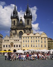 CZECH REPUBLIC, Stredocesky, Prague, Stare Mesto or Old Town Square. Crowds of people sitting at