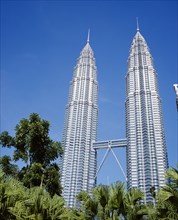 MALAYSIA, Kuala Lumpur, Petronas Twin Towers. Angled view looking up at the multi storey buildings