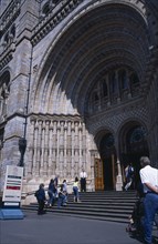 20059177 ENGLAND  London Kensington. Natural History Museum. Exterior view  with visitors walking up the steps to the main entrance.